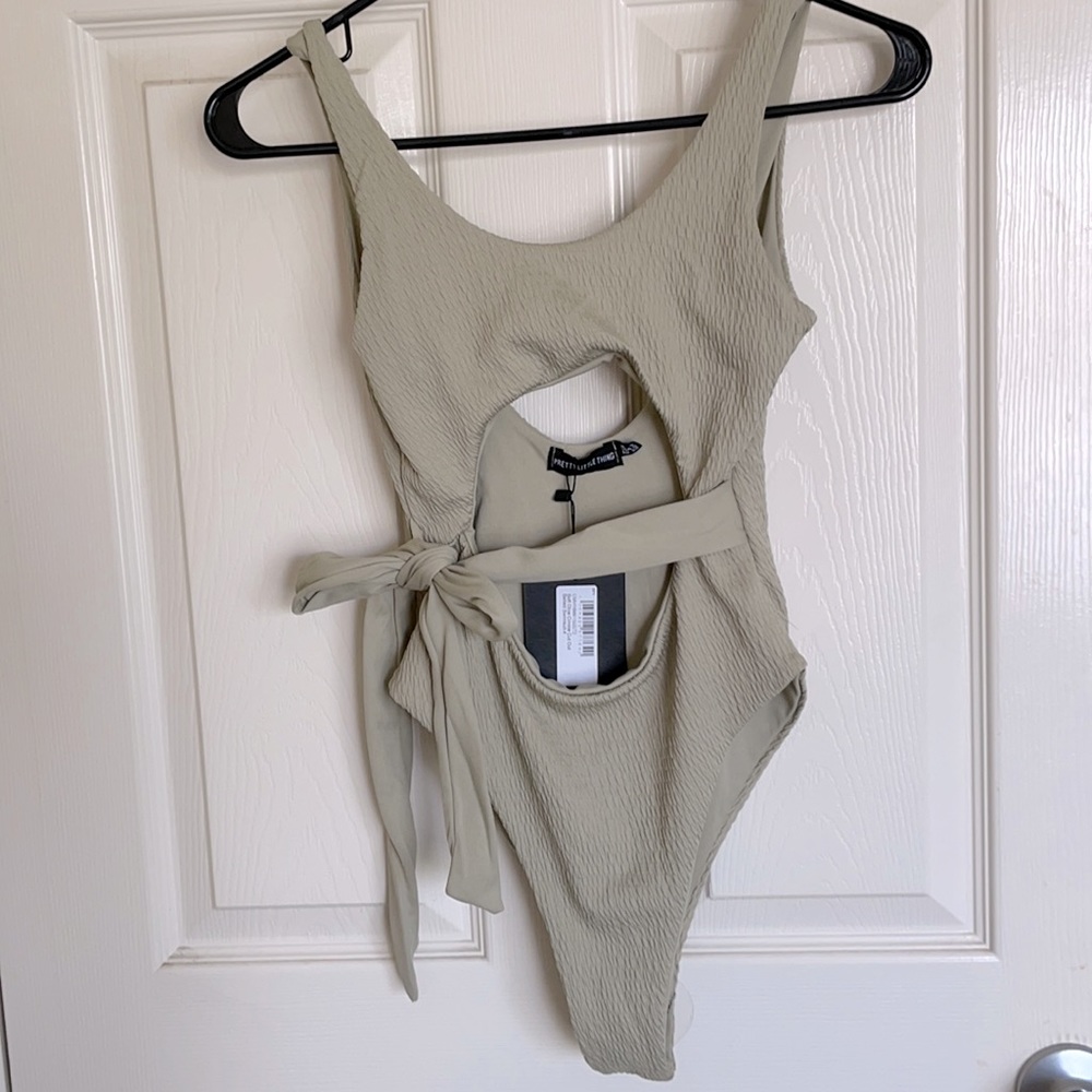 Pretty little thing women’s one piece crinkle cut out Olive bathing suit size 0